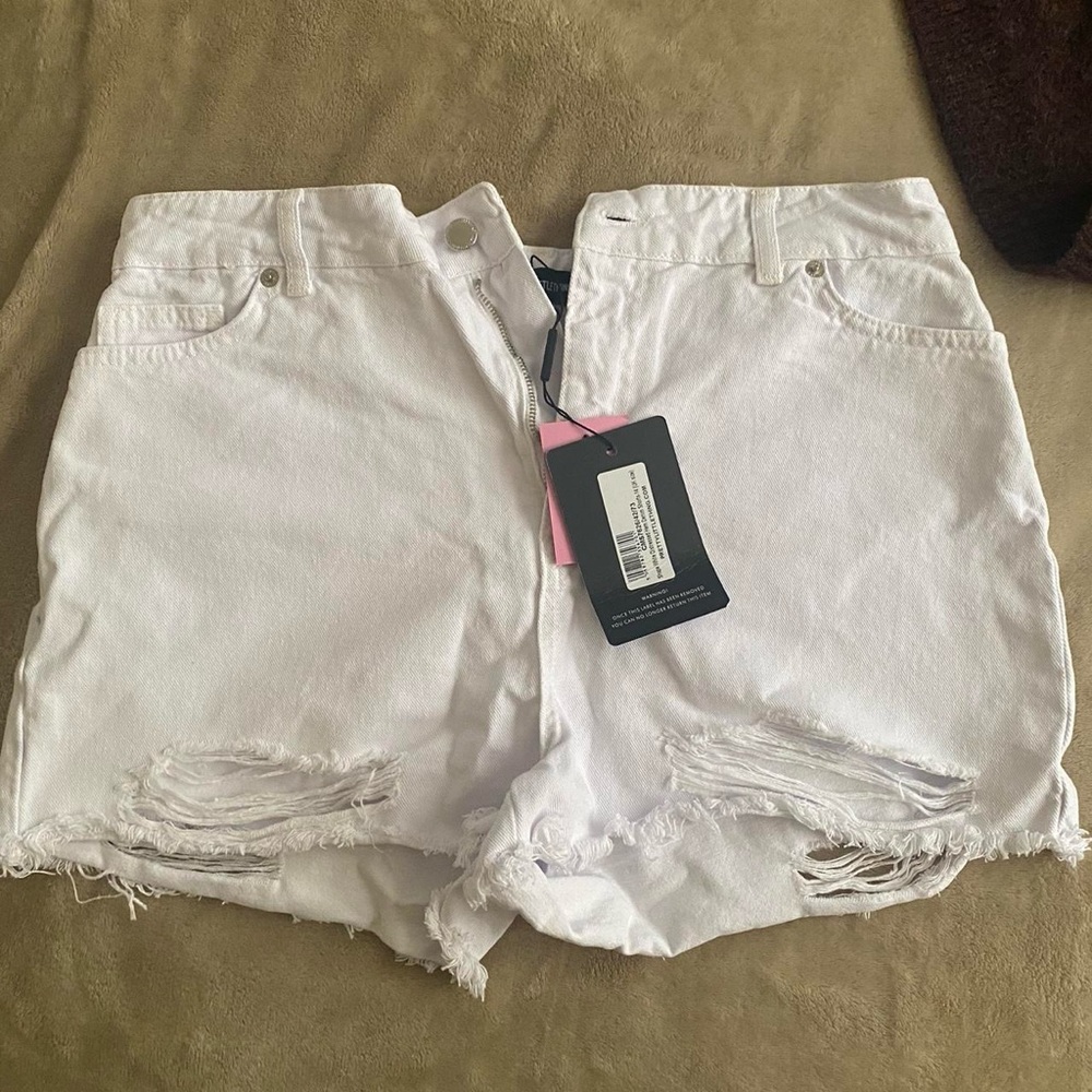 White distressed jean shorts